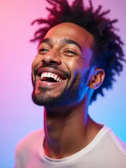 Happy man smiling, representing positivity and personal growth for nRecovery motivational platform.