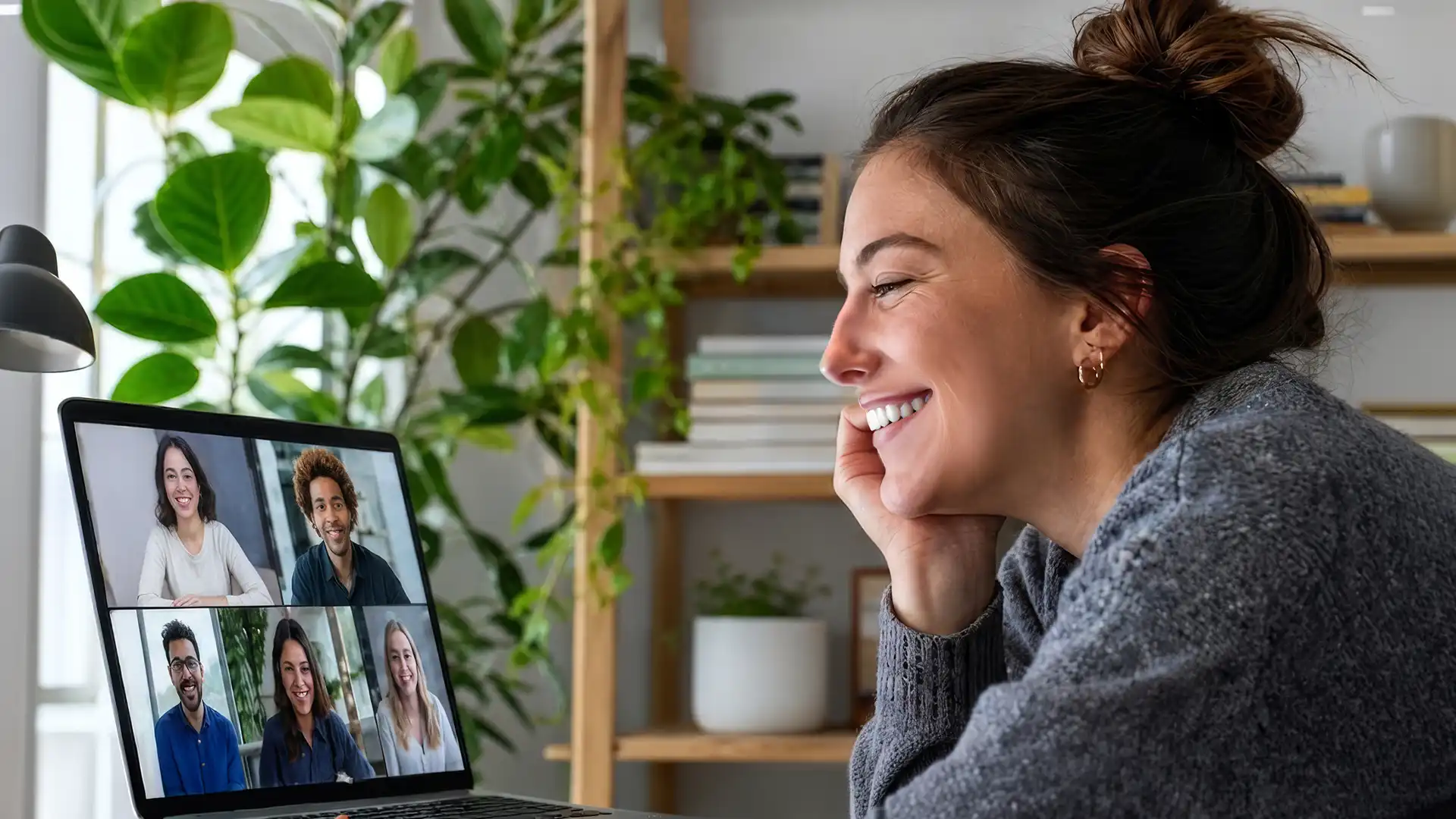 A woman participating in an nRecovery peer support video call, looking engaged and supported during a personal development session.